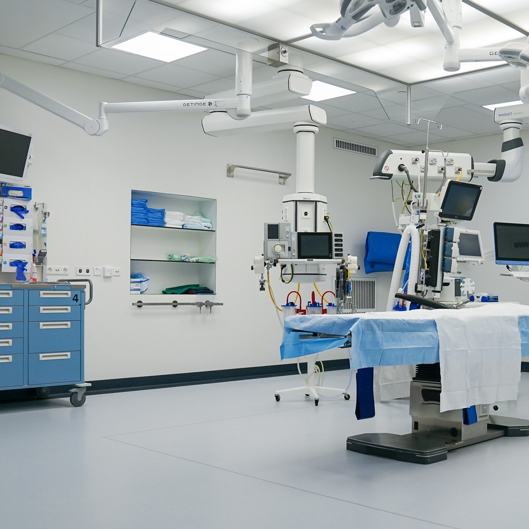 Empty operating theatre with surgical lights, anaesthesia equipment and patient monitors, the connected clinical devices a hospital network has to contain
