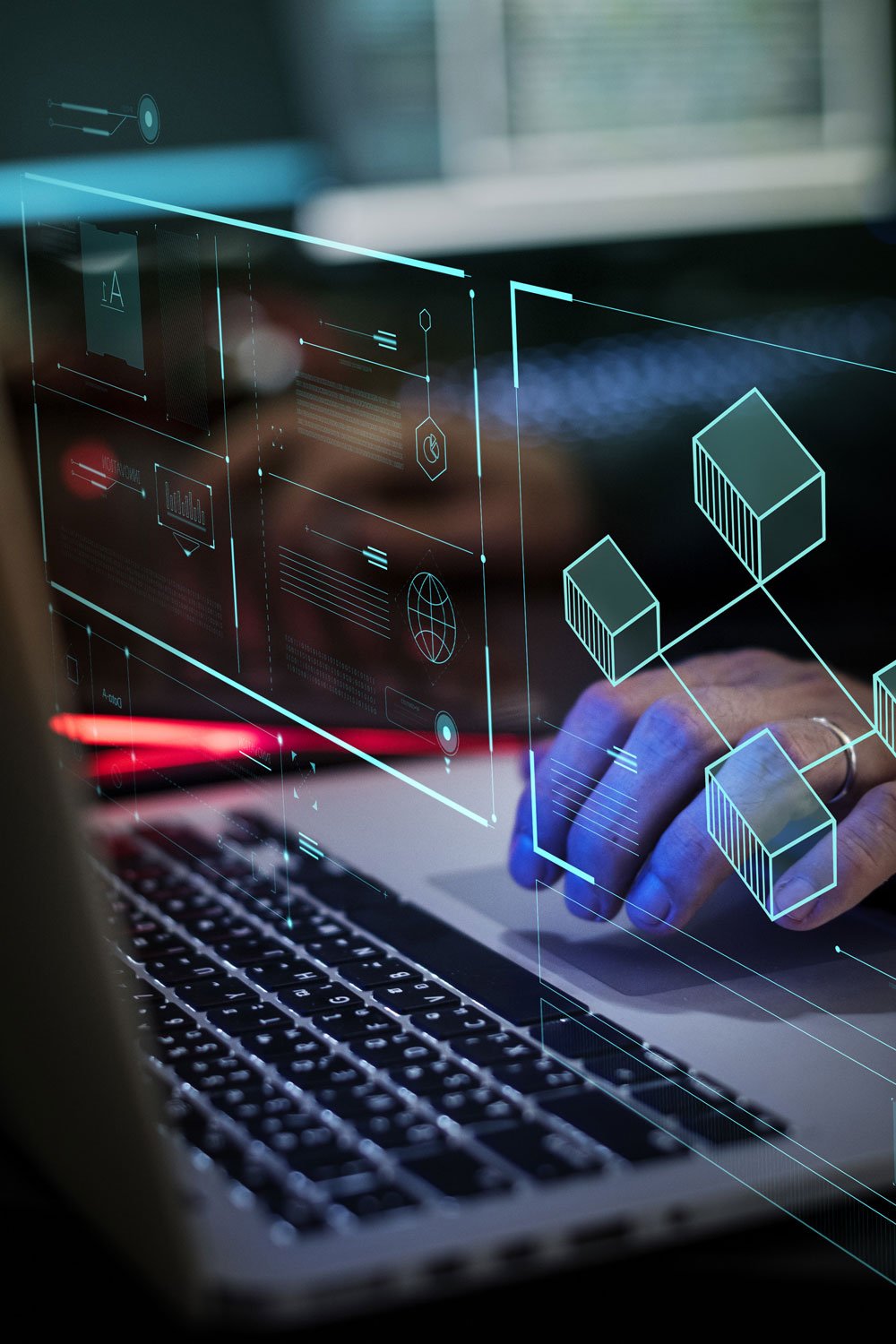 Penetration tester working at a laptop with network and application diagrams overlaid on the screen